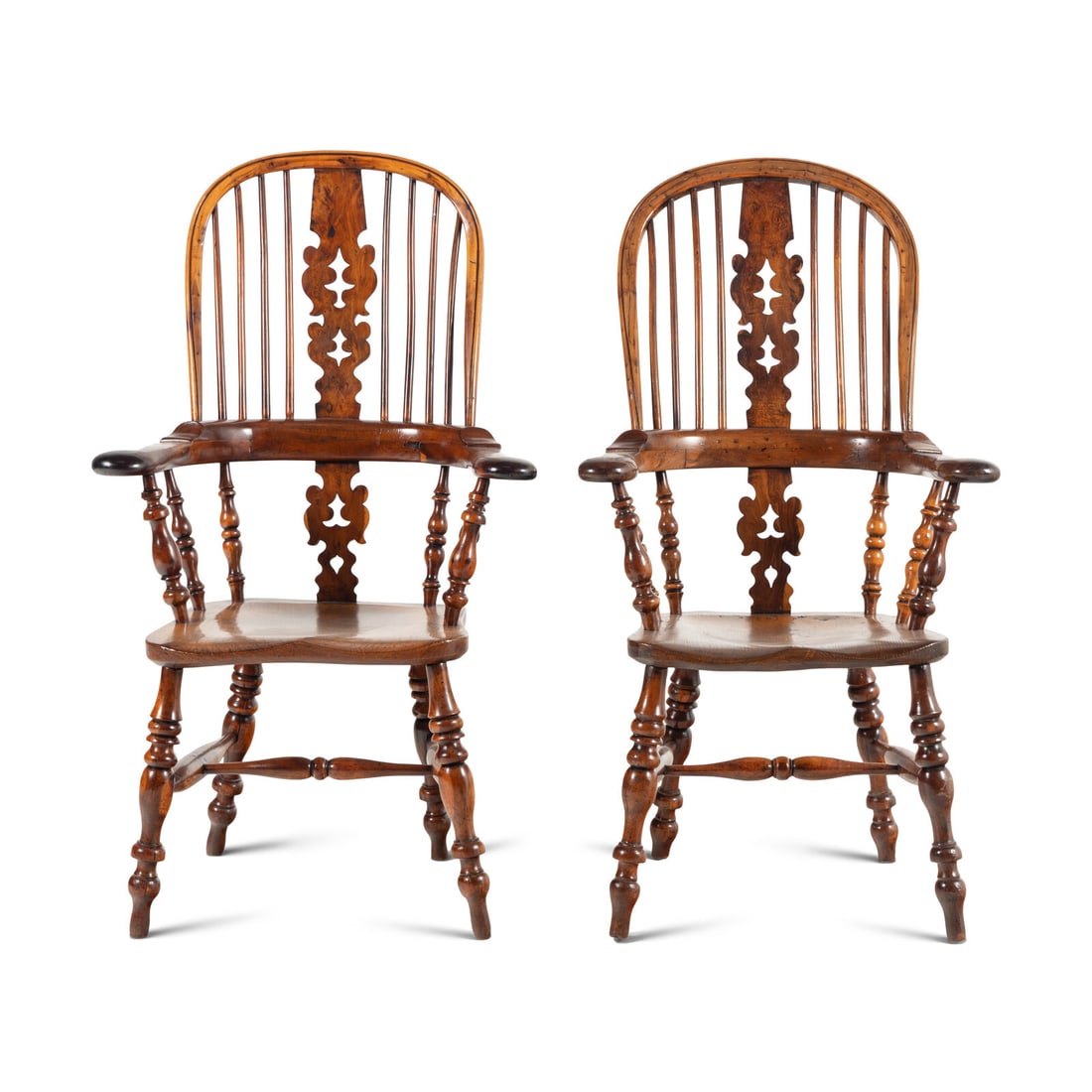 A Near Pair of English Yew and Elm Windsor Chairs: A Near Pair of English Yew and Elm Windsor Chairs 18th Century Height of larger 44 3/4 x width 26 x depth 21 inches. Property from the Collection of Robert and Roseann Drucker, Wilmette, IL This lot