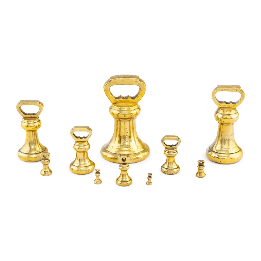 An Assembled Set of Ten English Brass Weights: An Assembled Set of Ten English Brass Weights Herbert and Sons Ltd., Smithfield 19th Century and Others comprising 14 lbs, 7 lbs, 4 lbs, 2 lbs, 1 lb, 8 oz., 4 oz., 2 oz., 1 oz and 1/2 oz examples,