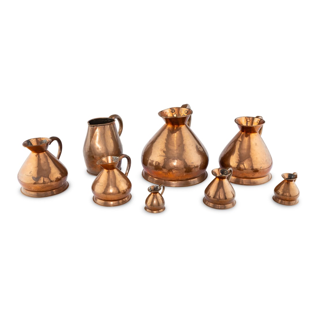 A Group of Eight Copper Wine Measures (1 of 2)
