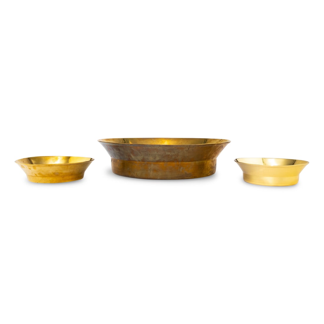 A Group of Three Brass Basins: A Group of Three Brass Basins 19th Century Height of largest 5 x diameter 20 1/2 inches. This lot is located in Chicago.
