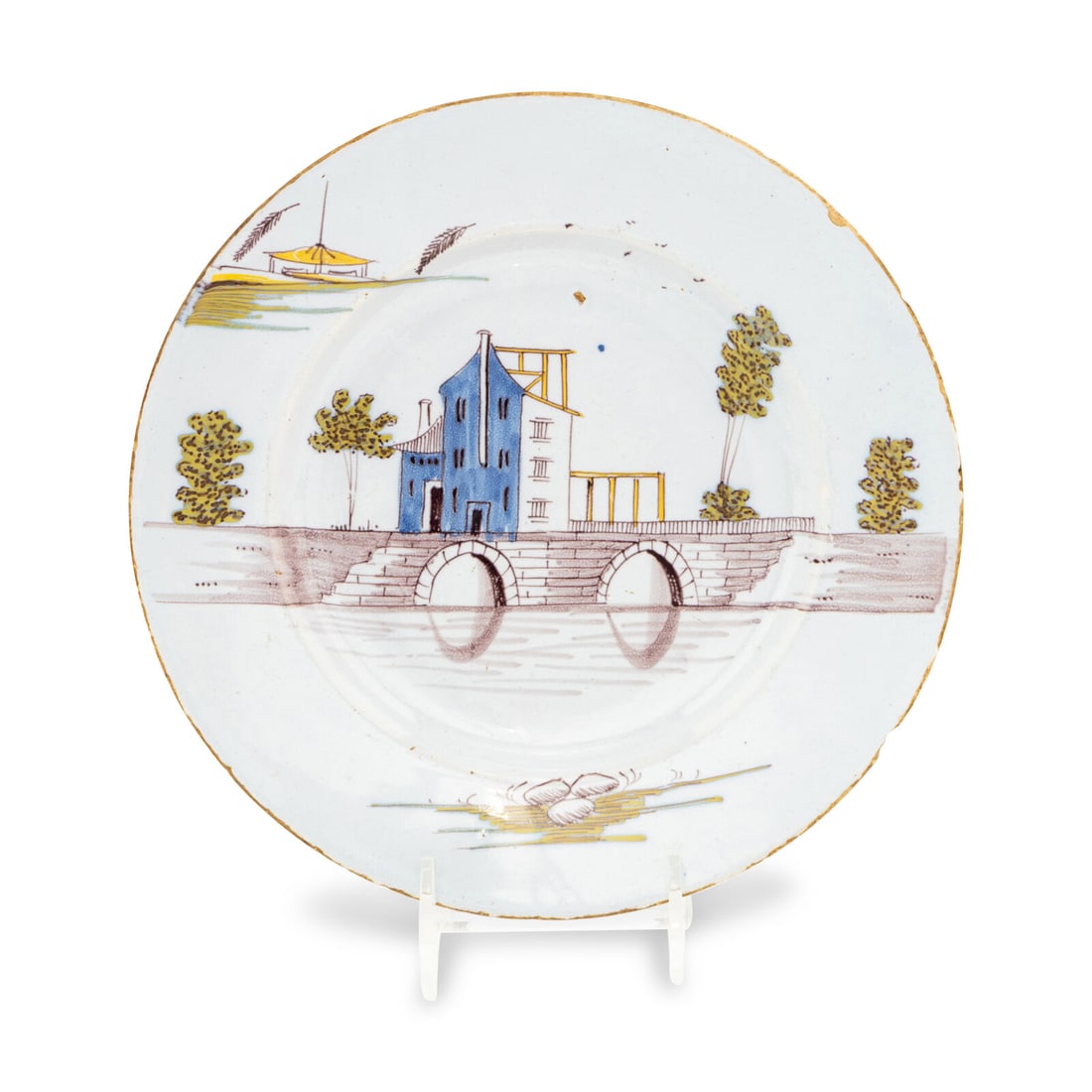 A Dutch Delft Town-Scene Plate: A Dutch Delft Town-Scene Plate 18th Century the underside with an artist's glyph in underglaze blue. Diameter 8 3/4 inches. Property from the East Coast Collection of Peter S. Ely This lot is located