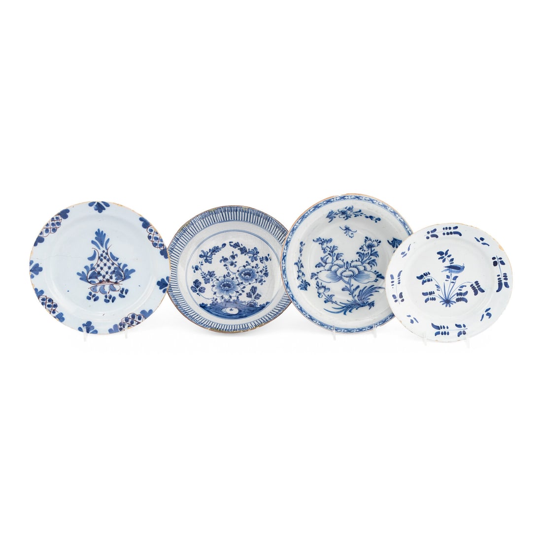 A Collection of Four Delft Blue and White Decorated Articles: A Collection of Four Delft Blue and White Decorated Articles 18th Century comprising an English Delftware bowl, a Dutch delft bowl and two Dutch plates, each decorated with floral and foliate motifs.