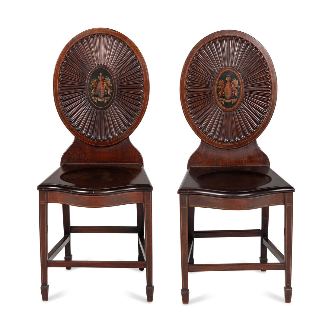A Pair of Regency Style Mahogany and Polychrome Decorated Hall Chairs: A Pair of Regency Style Mahogany and Polychrome Decorated Hall Chairs First Half 20th Century Height 38 x width 16 1/2 x depth 17 inches. Property from a Private Collection This lot is located in
