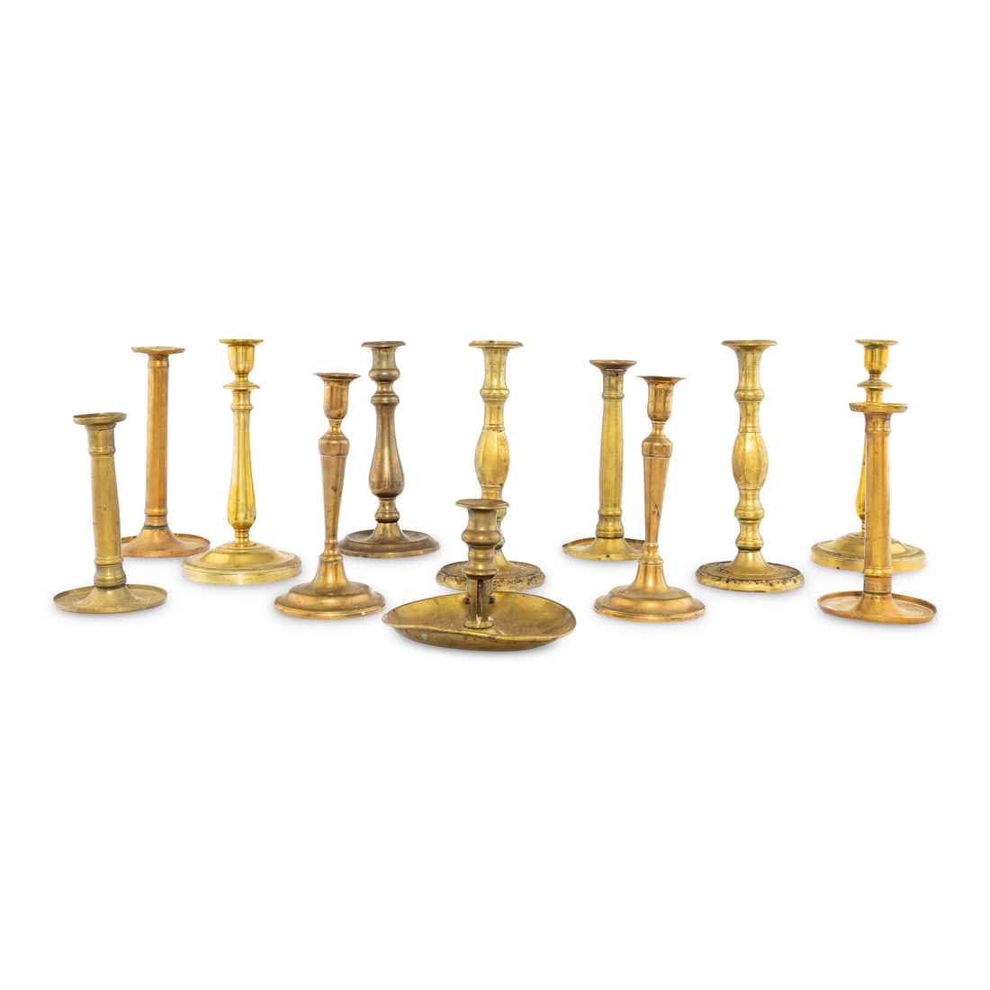 A Collection of Twelve Brass Candlesticks (1 of 2)
