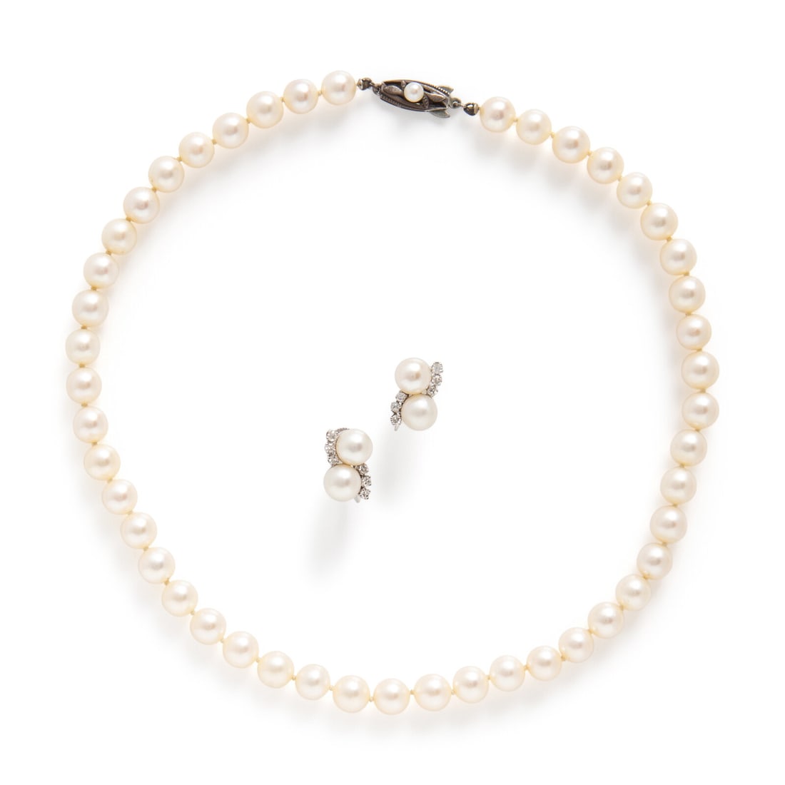 Mikimoto, Cultured Pearl Necklace and a Pair of Unsigned Cultured Pearl and Diamond Earrings: Mikimoto, Cultured Pearl Necklace and a Pair of Unsigned Cultured Pearl and Diamond Earrings Including a strand of cultured pearls measuring approximately 7.25 mm, and a pair of earrings set with cult