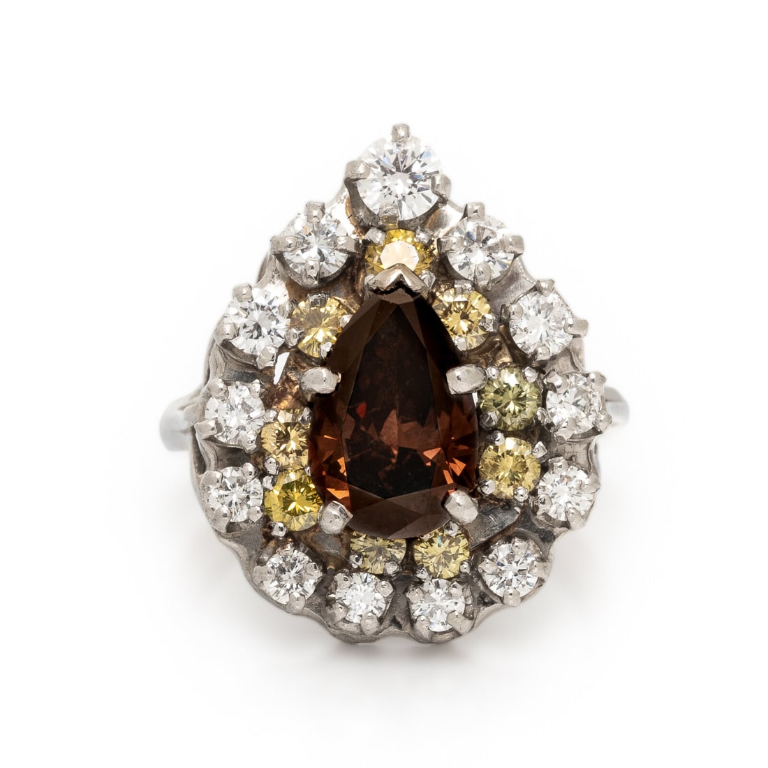 Colored Diamond and Diamond Ring: Colored Diamond and Diamond Ring Fancy brown pear shape diamond weighing approximately 1.55 carats (origin of color not tested), round yellow diamonds (origin of color not tested), and round diamonds.