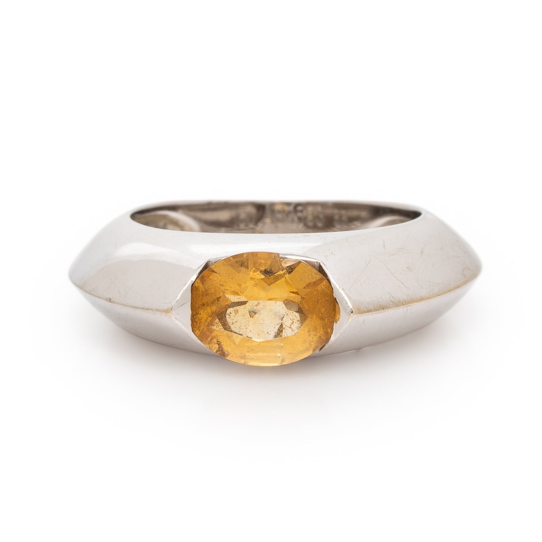 Piaget, Citrine, Diamond, and White Gold Ring: Piaget, Citrine, Diamond, and White Gold Ring Oval citrine and a round diamond. 18 karat yellow gold. Ring size 7 1/4. Stamp: 750 A83593 55 PIAGET 1998. Gross weight: 7.40 dwt. This lot is located in 
