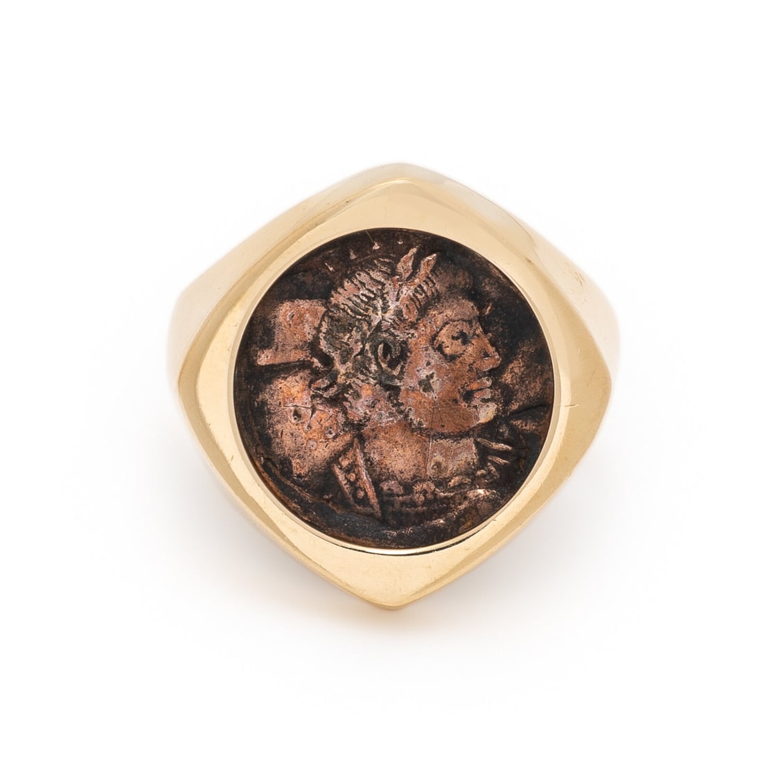 Yellow Gold and Ancient Bronze Coin Ring: Yellow Gold and Ancient Bronze Coin Ring Ancient bronze coin measuring approximately 15.00 mm. 14 karat yellow gold. Ring size 9 1/2. Stamp: 14K. Gross weight: 5.00 dwt. From a Private Collection, Pre