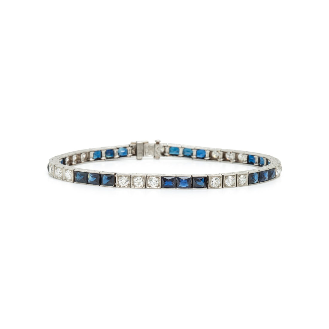 Sapphire and Diamond Line Bracelet: Sapphire and Diamond Line Bracelet Round diamonds weighing approximately 1.90 carats total and calibrÈ-cut sapphires. Platinum. 7 inches long. Gross weight: 11.95 dwt. This lot is located in Chic