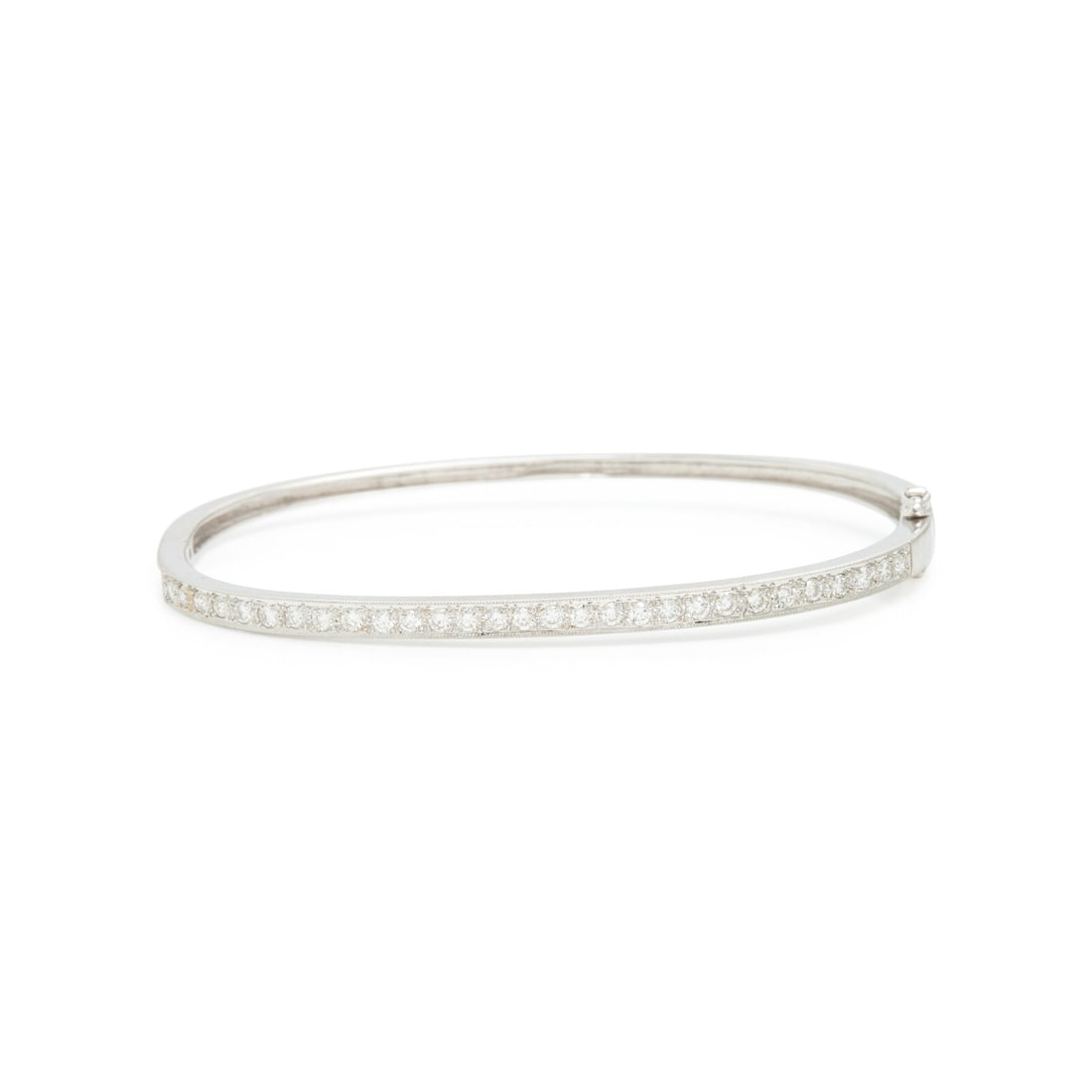 Diamond and White Gold Bangle Bracelet: Diamond and White Gold Bangle Bracelet Round diamonds weighing approximately 0.65 carat total, hinged with a side clasp. 18 karat white gold. 6 1/2 inches inner circumference. Stamp: 750. Gross weight