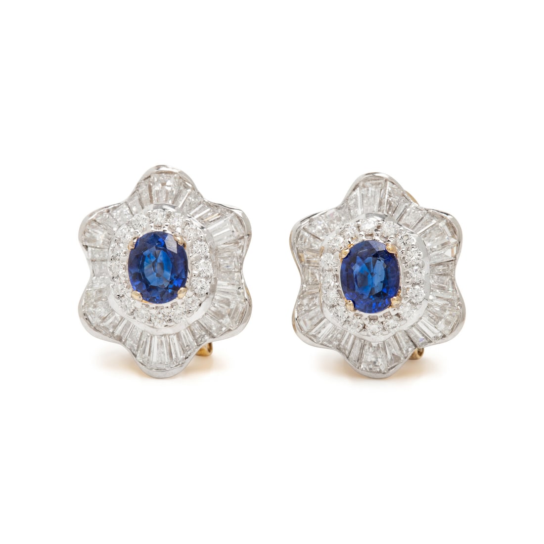 Sapphire and Diamond Earrings: Sapphire and Diamond Earrings Oval sapphires weighing approximately 2.00 carats total by formula, and round, tapered baguette, and baguette cut diamonds weighing approximately 4.20 carats total. 18