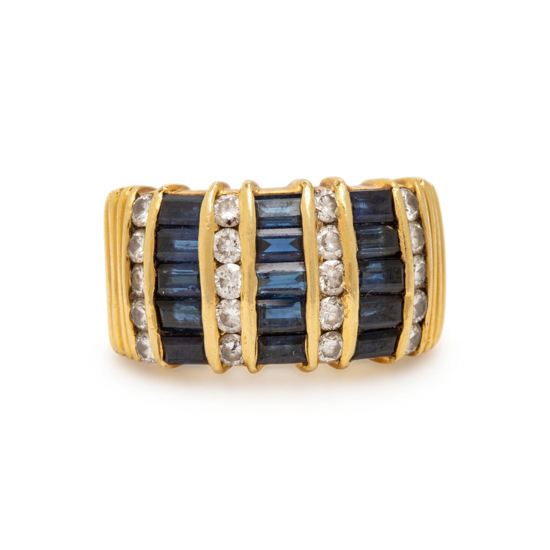Yellow Gold, Sapphire, and Diamond Ring: Yellow Gold, Sapphire, and Diamond Ring Channel set round diamonds weighing approximately 0.70 carat total, and channel set baguette cut sapphires. 18 karat yellow gold. Ring size 7. Stamp: 18K.