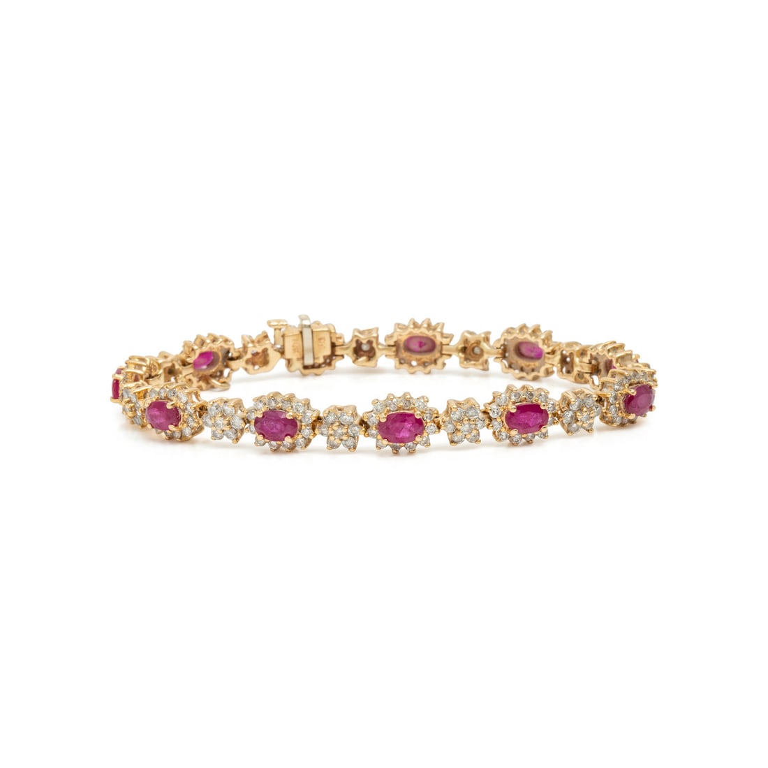 Ruby, Diamond, and Yellow Gold Bracelet: Ruby, Diamond, and Yellow Gold Bracelet Oval rubies, and round diamonds weighing approximately 3.30 carats total. 14 karat yellow gold. 7 inches long. Stamp: RH 14K. Gross weight: 12.15 Ruby Phelps