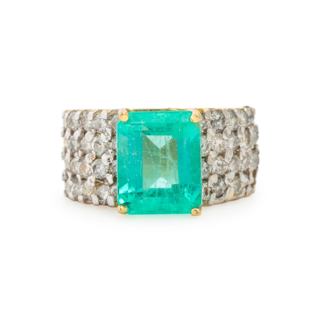Emerald, Diamond, and Yellow Ring: Emerald, Diamond, and Yellow Ring Emerald cut emerald weighing approximately 3.95 carats by formula, and round diamonds weighing approximately 1.75 carats total. 18 karat yellow gold. Ring size 6.