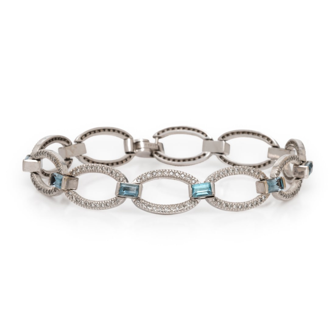 Blue Topaz and Diamond Bracelet: Blue Topaz and Diamond Bracelet Emerald cut blue topaz, and round diamonds weighing approximately 1.10 carats total. 7 inches long. Stamp: 14K (maker's mark). Gross weight: 10.05 dwt. From the