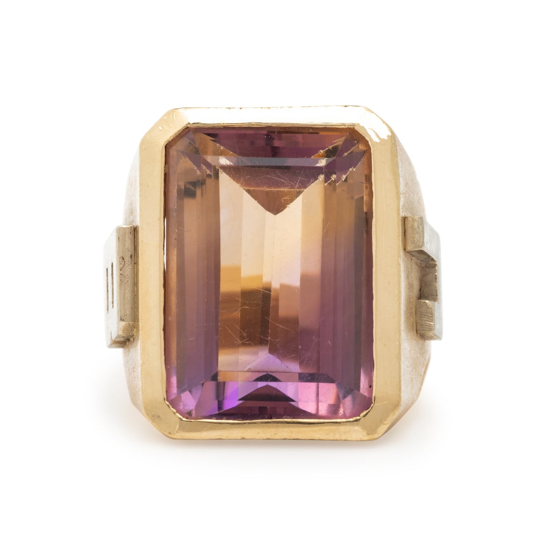 Yellow Gold and Ametrine Ring: Yellow Gold and Ametrine Ring Emerald cut ametrine weighing approximately 27.85 carats by formula. 14 karat yellow and white gold. Ring size 11 1/2. Stamp: (maker's mark) 14K. Gross weight: 22.05