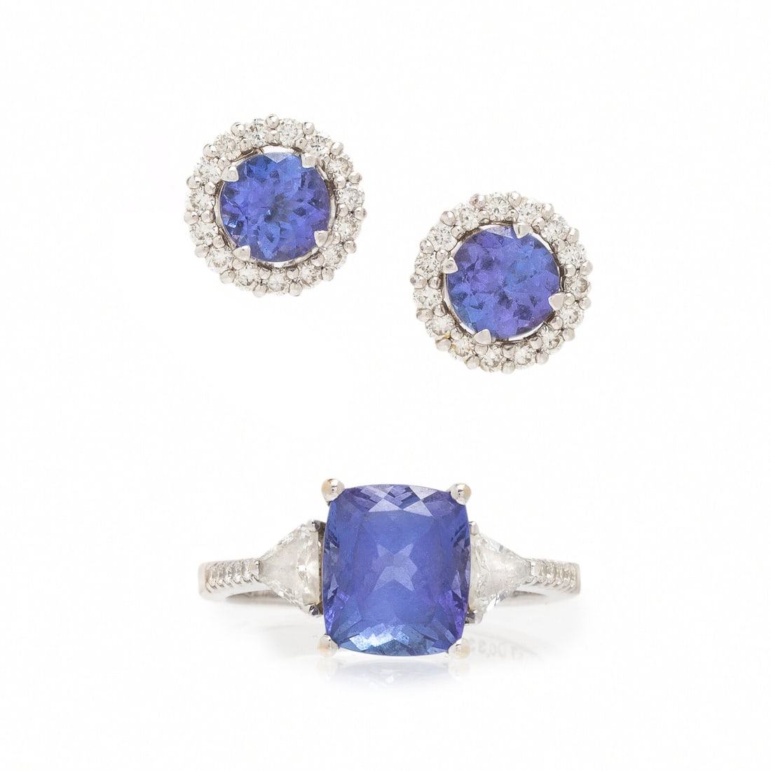 Tanzanite and Diamond Ring and Earrings: Tanzanite and Diamond Ring and Earrings Including a pair of earrings and ring, the earrings set with round tanzanite measuring approximately 6.10 x 6.10 mm, with jackets set with round diamonds, and