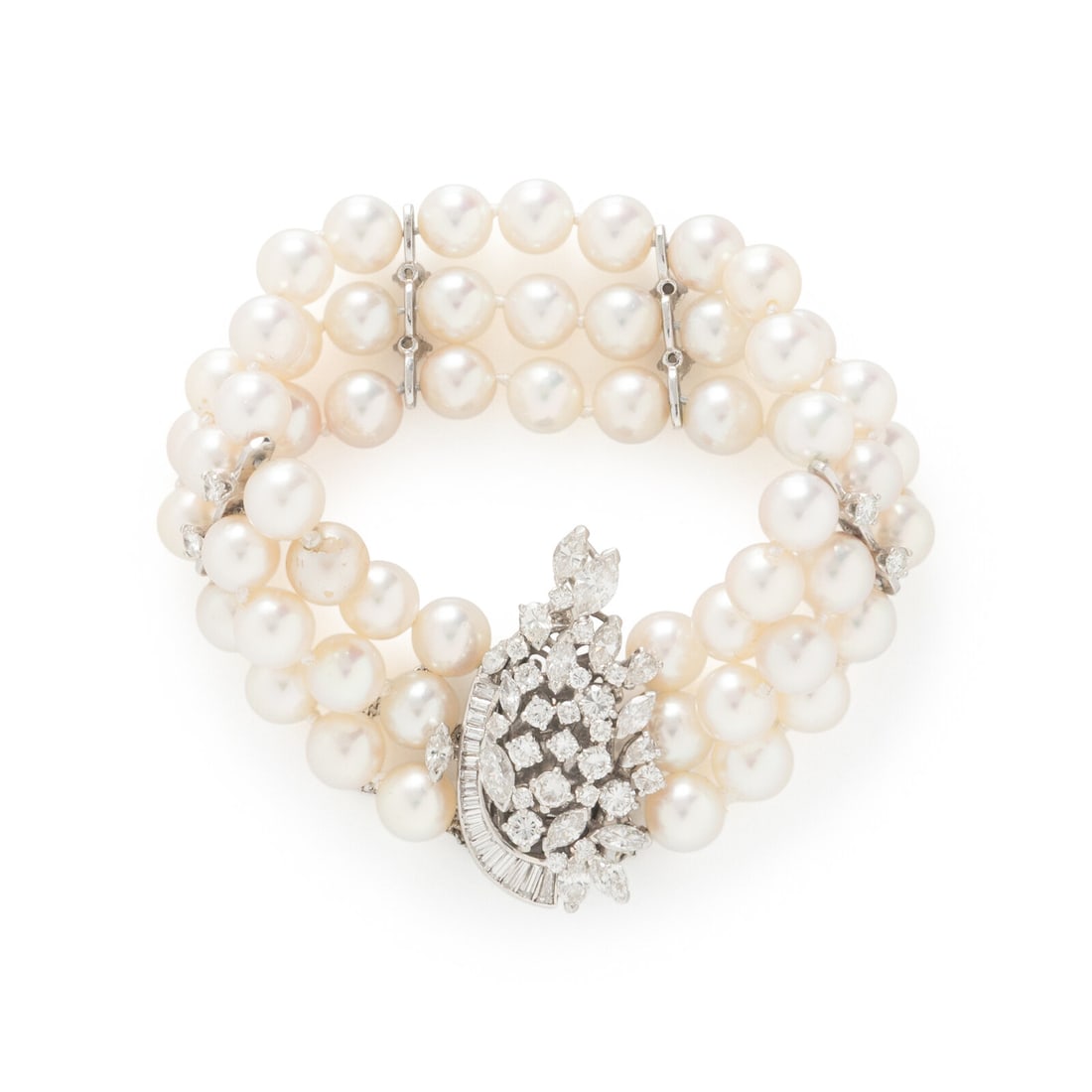 Cultured Pearl, Diamond, and Platinum Bracelet: Cultured Pearl, Diamond, and Platinum Bracelet Cultured pearls measuring approximately 7.50 - 7.60 mm and round, pear shape, tapered baguette cut, and marquise cut diamonds weighing approximately 4.15