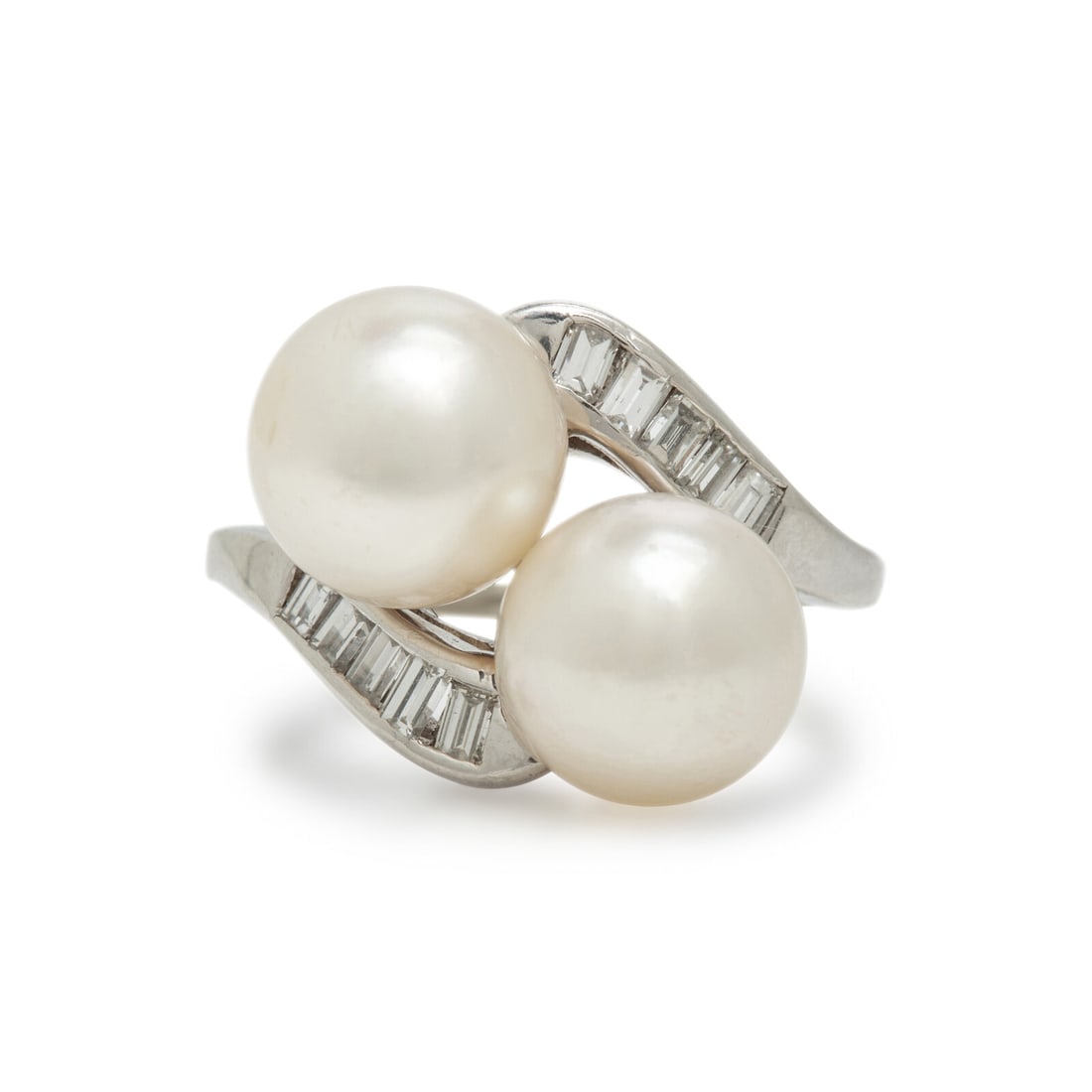 Cultured Pearl and Diamond Ring: Cultured Pearl and Diamond Ring Two cultured pearls, measuring approximately 8.70 mm and 8.90 mm, and baguette cut diamonds. White gold. Ring size 6 1/2. Gross weight: 3.95 dwt. The Property of an Eva