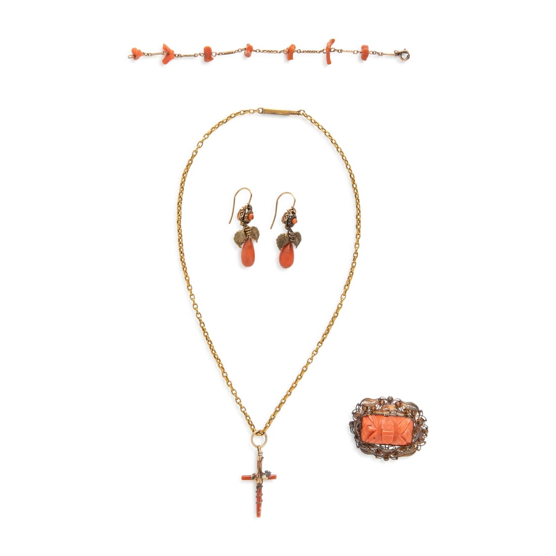 Collection of Coral and Yellow Gold Jewelry: Collection of Coral and Yellow Gold Jewelry Including a cross necklace with coral and a seed pearl, a brooch with carved coral, a pair of earrings with teardrop carved coral and a coral bead, and a ch