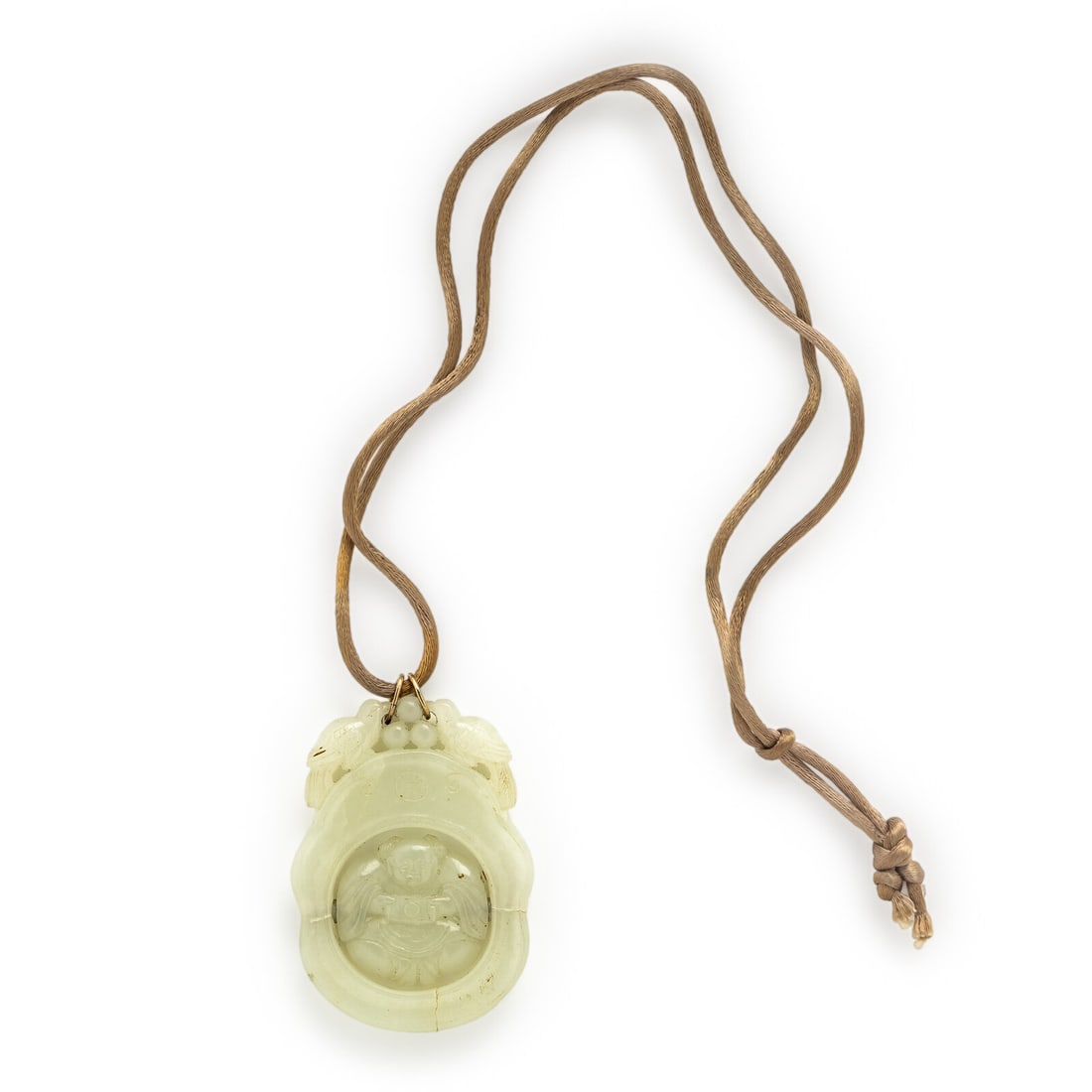 Early 20th Century, Carved Jade Pendant Necklace: Early 20th Century, Carved Jade Pendant Necklace Carved jade, with spinner carved Buddha figure, on a silk cord. Yellow gold. 30 inches long, with a pendant measuring 2 x 2 3/4 inches. Gross weight: