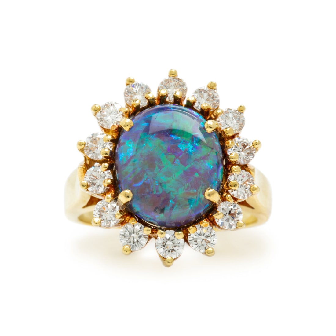 Black Opal, Diamond, and Yellow Gold Ring: Black Opal, Diamond, and Yellow Gold Ring Oval cabochon opal measuring approximately 12.20 x 10.40 x 5.55 mm and round diamonds weighing approximately 1.40 carats total. 18 karat yellow gold. Ring siz