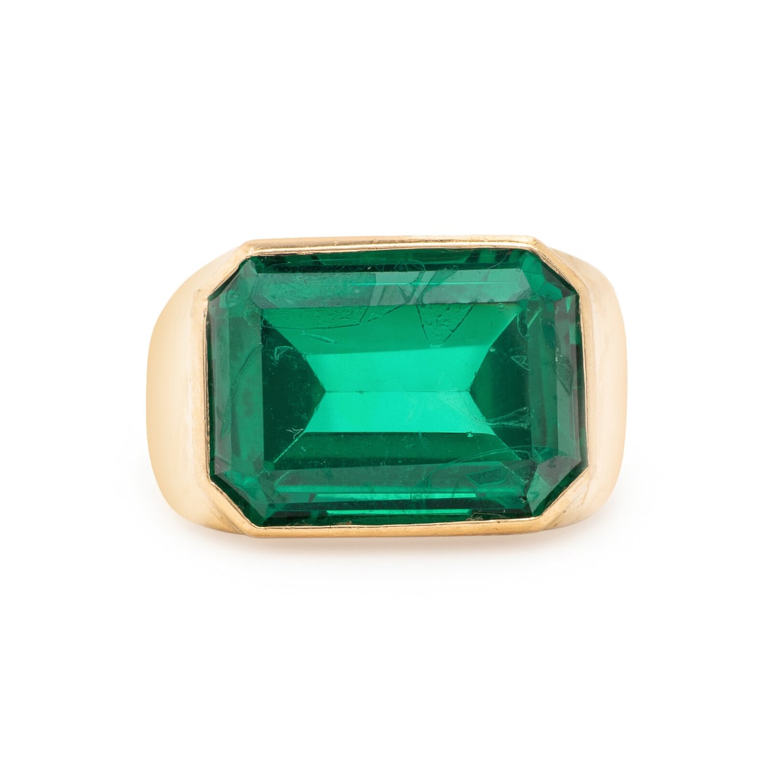 Yellow Gold and Synthetic Spinel Ring: Yellow Gold and Synthetic Spinel Ring Emerald cut green synthetic spinel measuring approximately 17.20 x 12.65 x 7.95 mm. Yellow gold. Ring size 10 1/2. Gross weight: 8.50 dwt. From a Private Collecti