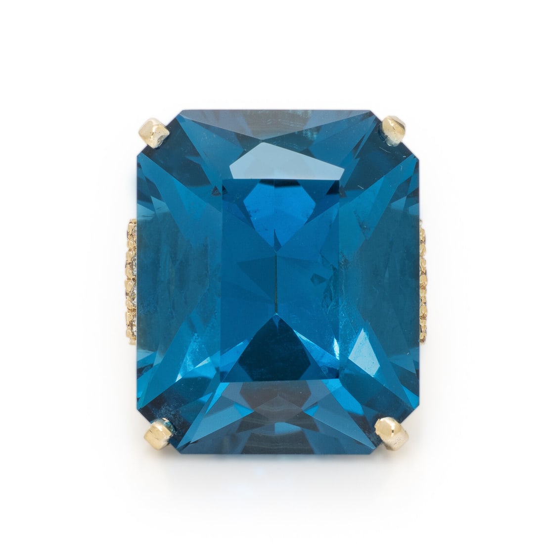 Blue Topaz and Diamond Ring: Blue Topaz and Diamond Ring Emerald cut blue topaz weighing approximately 36.95 carats by formula, and pavÈ-set round diamonds weighing approximately 0.35 carat total. 14 karat yellow gold. Ring 
