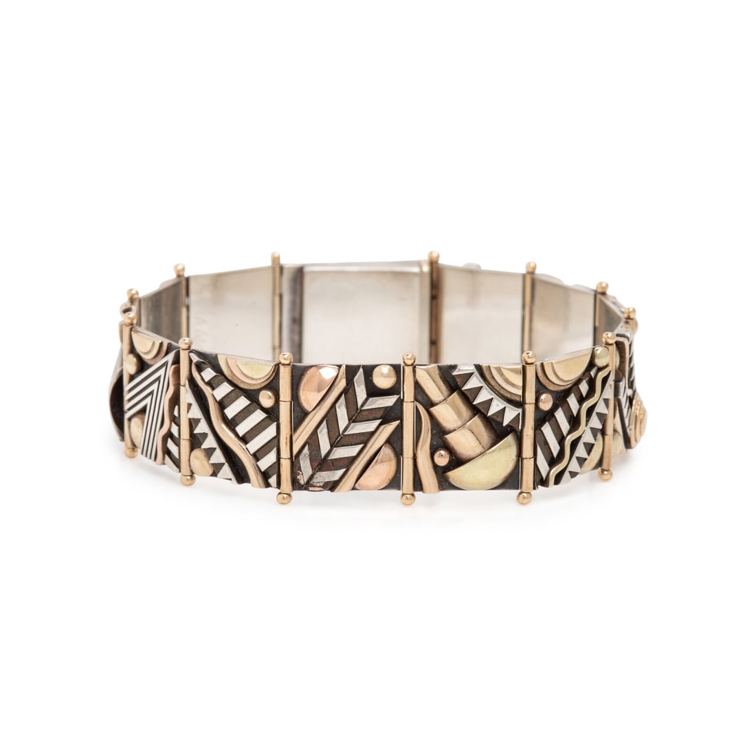 Aaron MacSai, Yellow Gold and Silver Geometric Bracelet: Aaron MacSai, Yellow Gold and Silver Geometric Bracelet Yellow gold and silver. 6 7/8 inches long. Engraved: A. MacSai '90. Gross weight: 27.35 dwt. The Property of an Evanston Lady This lot is