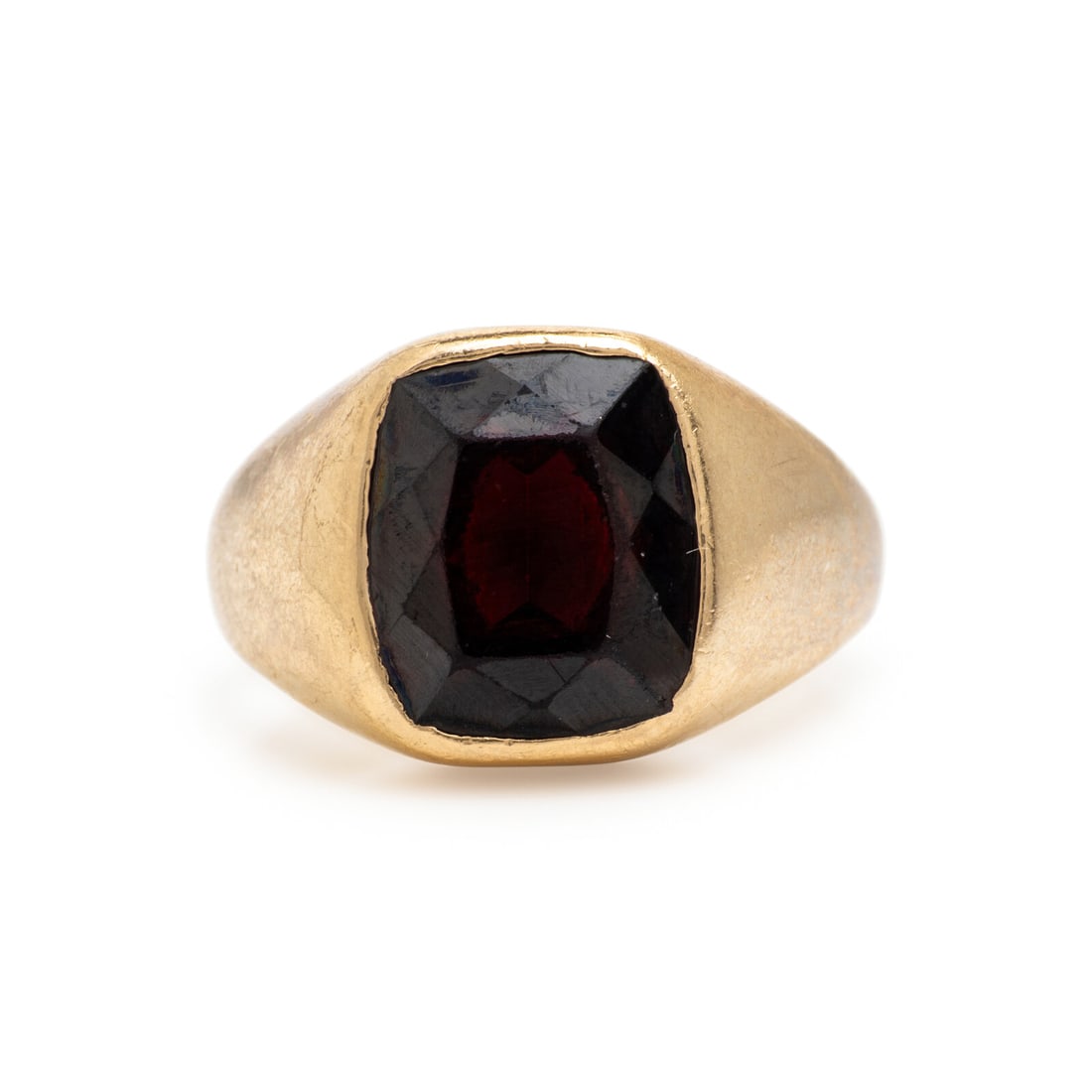 Garnet and Yellow Gold Ring: Garnet and Yellow Gold Ring Cushion cut garnet weighing approximately 8.15 carats by formula. 14 karat yellow gold. Ring size 11. Stamp: 14K B&G. Gross weight: 7.90 dwt. From a Private Collection,