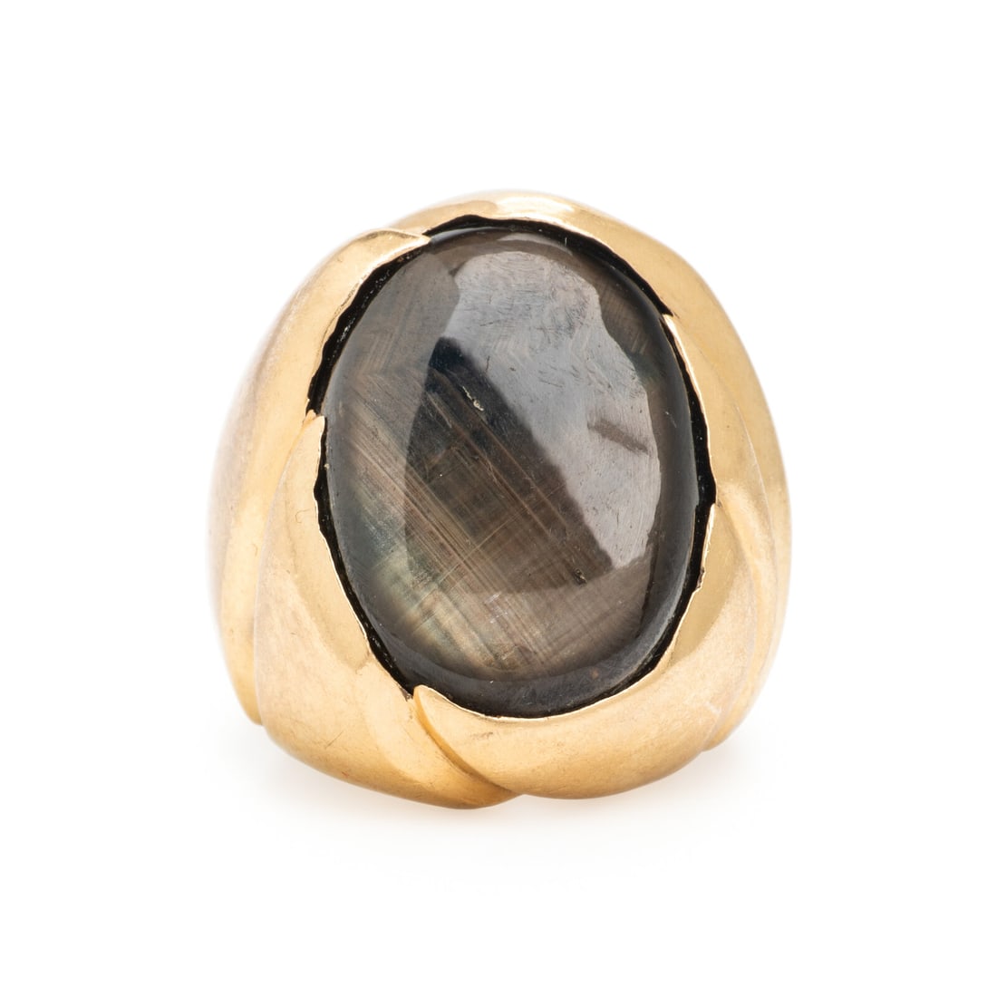 Black Star Sapphire and Yellow Gold Ring: Black Star Sapphire and Yellow Gold Ring Oval cabochon black star sapphire weighing approximately 27.80 carats by formula. 14 karat yellow gold. Ring size 7. Stamp: (partially obscured) 14K. Gross