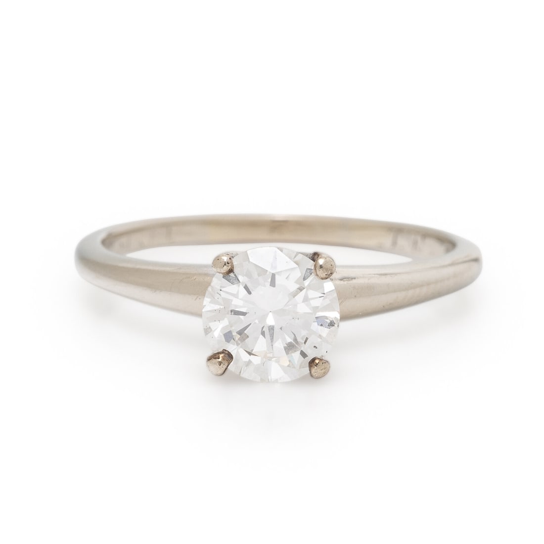 Diamond and White Gold Solitaire Ring: Diamond and White Gold Solitaire Ring Round diamond weighing approximately 0.95 carat. 14 karat white gold. Ring size 7 1/4. Stamp: (maker's mark) 14K. Gross weight: 1.65 dwt. This lot is located in C