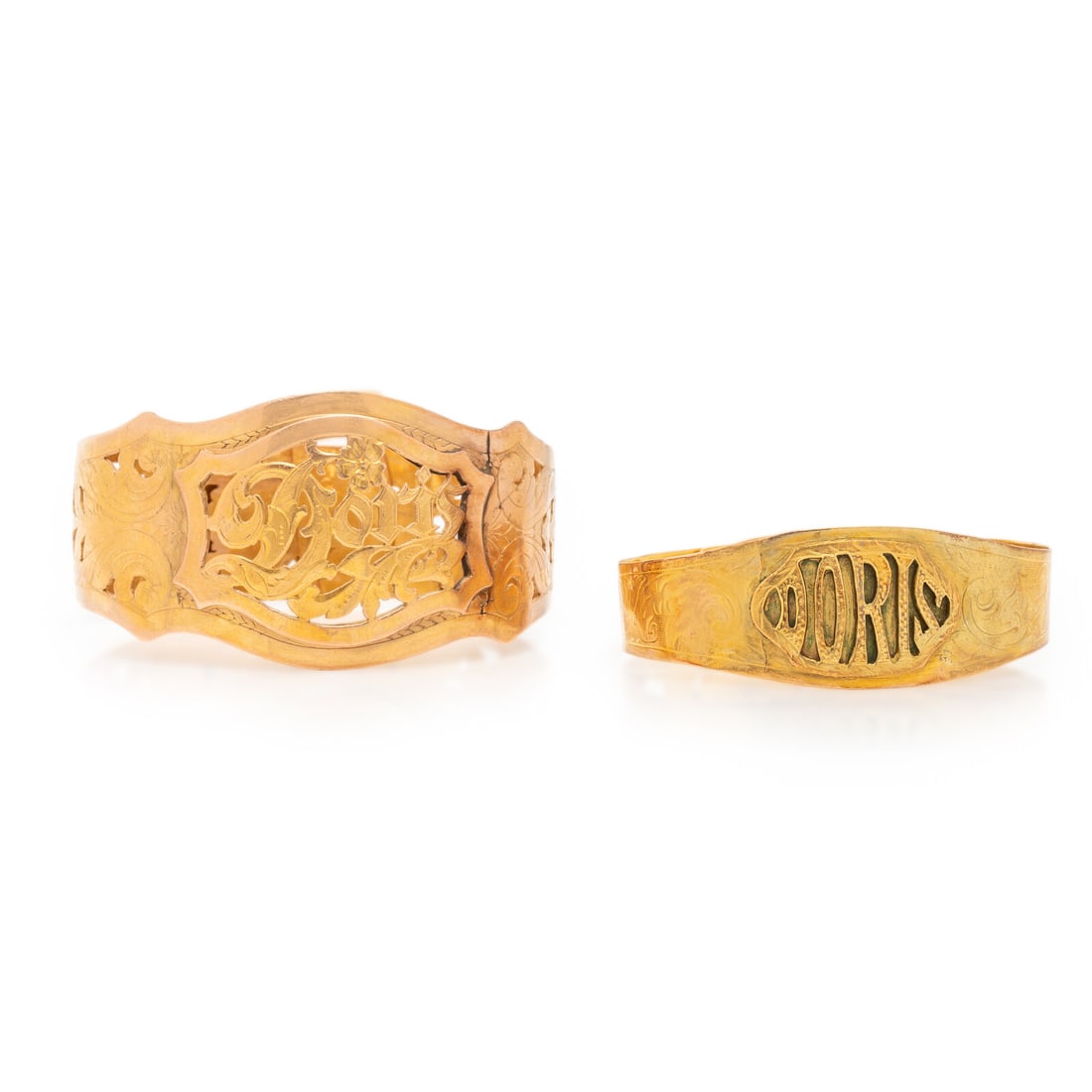 Two Yellow Gold 'Doris' Bangle Bracelets: Two Yellow Gold 'Doris' Bangle Bracelets Including two bangle bracelets featuring the name 'Doris', with adjustable buckle clasps. Yellow gold. 6 1/4 - 7 inches inner circumference. 5 1/4 - 6 1/4