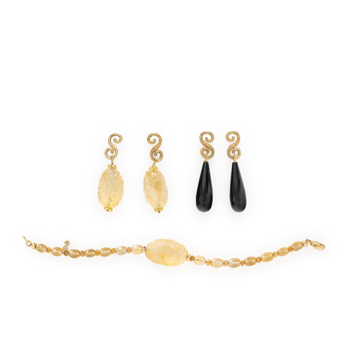 Splendid Co., Carved Citrine Bracelet and Earrings, and Black Spinel Teardrop Earrings: Splendid Co., Carved Citrine Bracelet and Earrings, and Black Spinel Teardrop Earrings Including a bracelet with faceted citrine beads and a carved citrine bead measuring approximately 23.40 x 15.10 x
