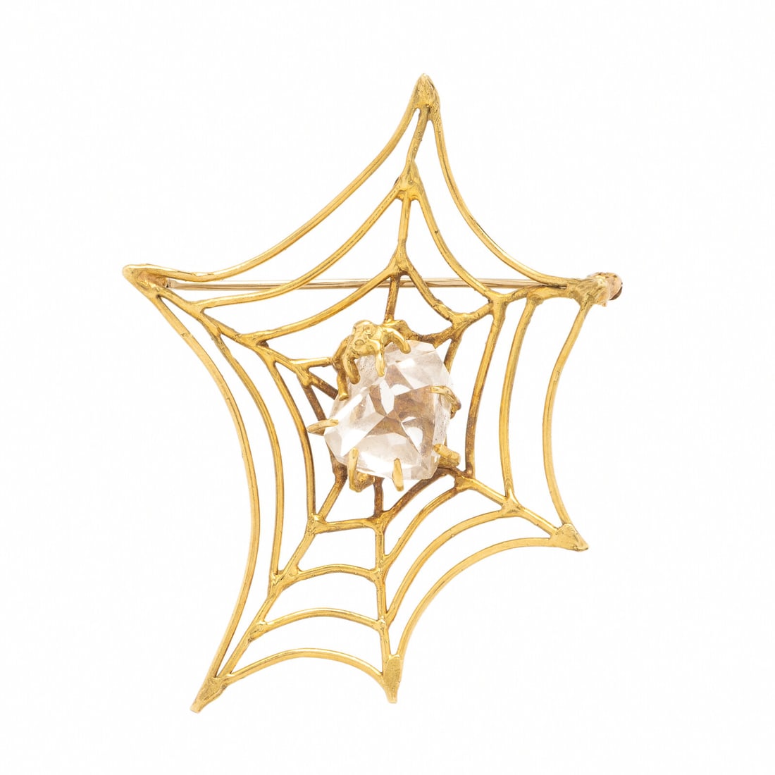 Quartz and Yellow Gold Spiderweb Brooch: Quartz and Yellow Gold Spiderweb Brooch Freeform faceted quartz. 18 karat yellow gold. 2 1/2 x 1 7/8 inches. Stamp: (maker's mark) 18K. Gross weight: 8.90 dwt. This lot is located in Chicago.
