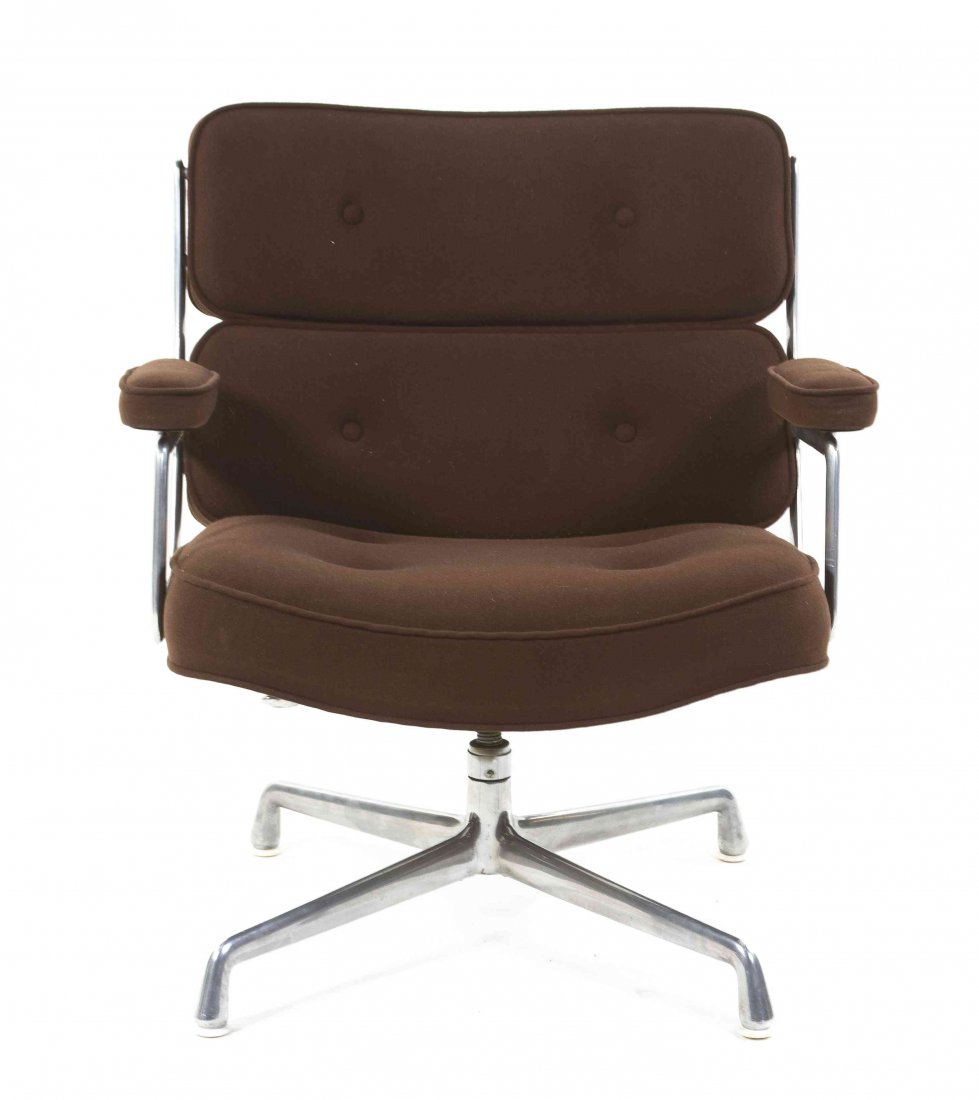 A Charles and Ray Eames Time-Life Chair, Height 31: A Charles and Ray Eames Time-Life Chair, 1979, having an upholstered tufted back and seat within an aluminum frame, raised on an adjustable pedestal base with original tag. Height 31 inches.