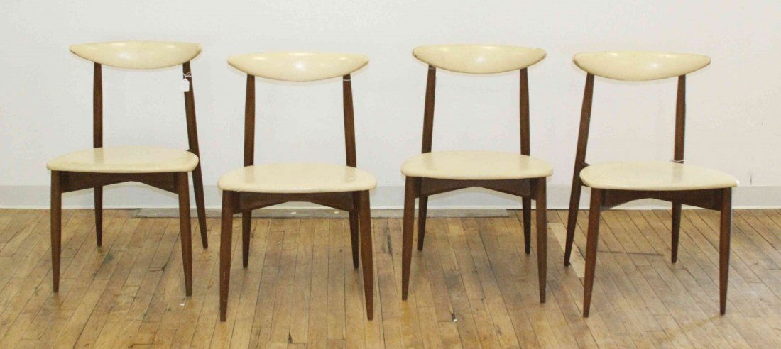 A Set of Four Hans Wegner Style Teak Chairs, Height 30: A Set of Four Hans Wegner Style Teak Chairs, each having a curved upholstered crest rail over the conforming seat, raised on tapering legs. Height 30 1/4 inches.