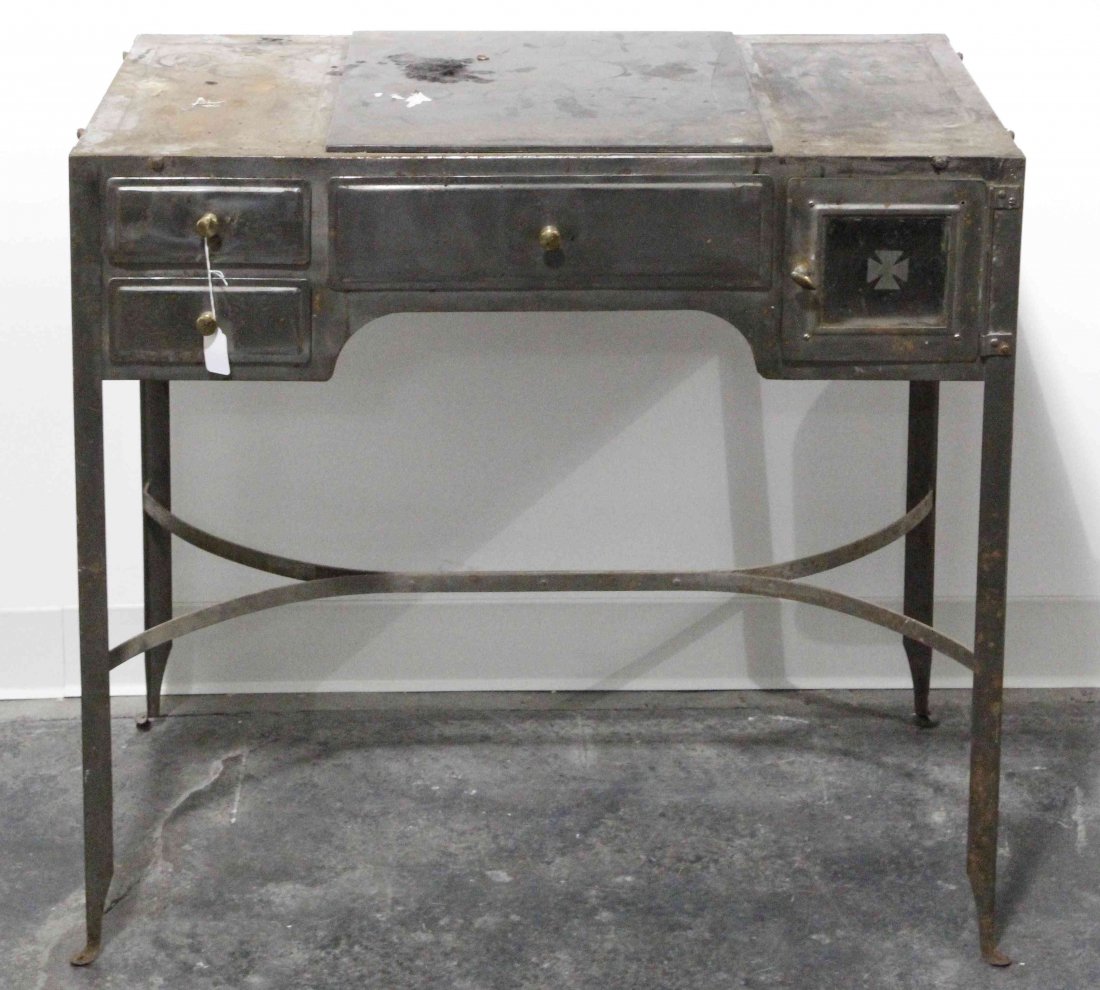 A Steel Dentist's or Doctor's Table, Height 30 x width: A Steel Dentist's or Doctor's Table, the rectangular top over a single drawer flanked by a small glazed door and two drawers, raised on four legs joined by stretchers. Height 30 x width 32 x depth 16 