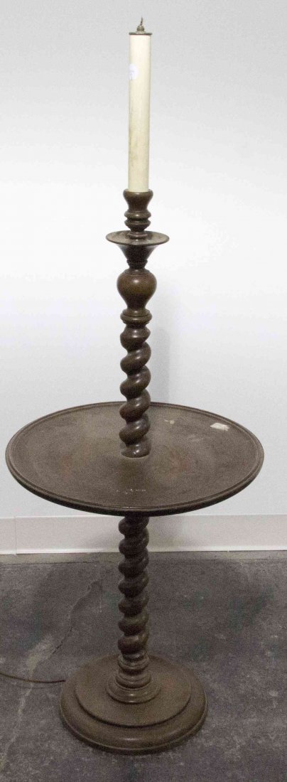 An American Lamp Table, Height 53 inches.: An American Lamp Table, having a twist form standard with a circular medial shelf, set on a conforming base. Height 53 inches.