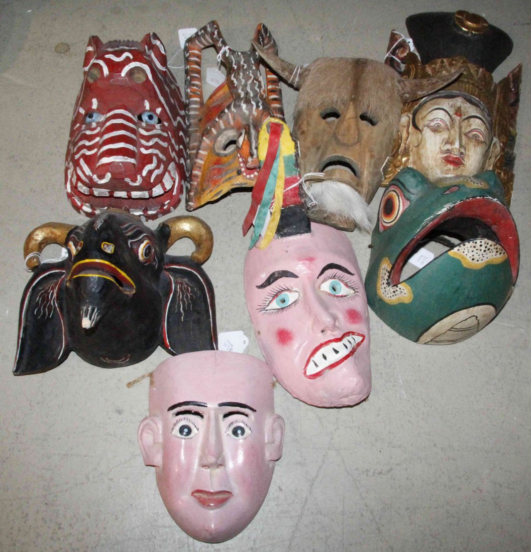 A Collection of Eight Carved Wood and Polychrome: A Collection of Eight Carved Wood and Polychrome Painted Masks, each from various cultures. Length of longest 13 inches. Property from the Estate of Dr. Ivan Jeanne Weiler, Urbana, Illinois