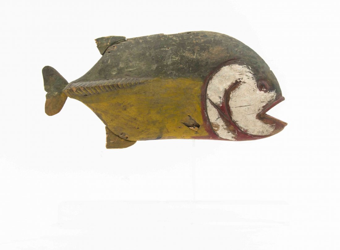 A Folk Art Carved Wood and Polychrome Decorated Fish,: A Folk Art Carved Wood and Polychrome Decorated Fish, depicting a piranha. Width 17 inches. Property from the Estate of Jeanne Marienthal Westcott, Chicago, Illinois