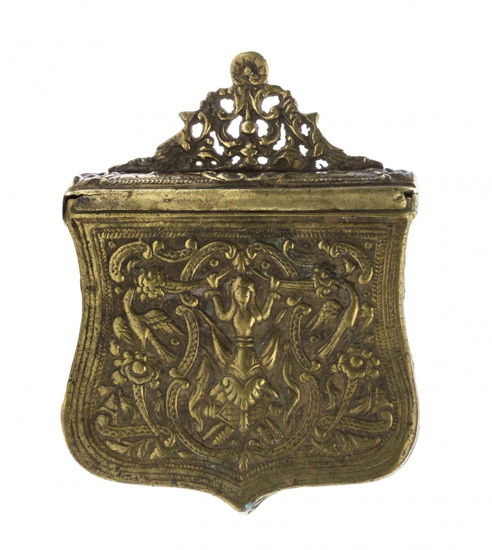 A Brass Gun Powder Box, Height 5 1/4 inches.: A Brass Gun Powder Box, having a hinged lid surmounted with a pierced finial, centered with a maiden with C-scroll and foliate decoration throughout. Height 5 1/4 inches. Property from the Children's 