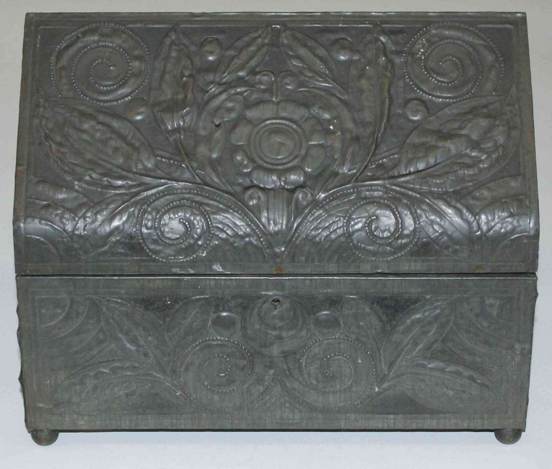 A Continental Metal Clad Table Casket, Width 10 3/4: A Continental Metal Clad Table Casket, having a peaked hinged top above a rectangular body decorated with flowers throughout. Width 10 3/4 inches. Property from the Estate of Mr. Emanuel Feingold, Hig