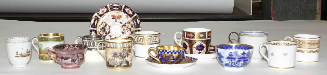 A Collection of English Tea Cups, Height of tallest 2: A Collection of English Tea Cups, late 19th/early 20th century, of various patterns and makers, together with two Royal Crown Derby Imari pattern saucers and a Coalport saucer. Height of tallest 2 1/2