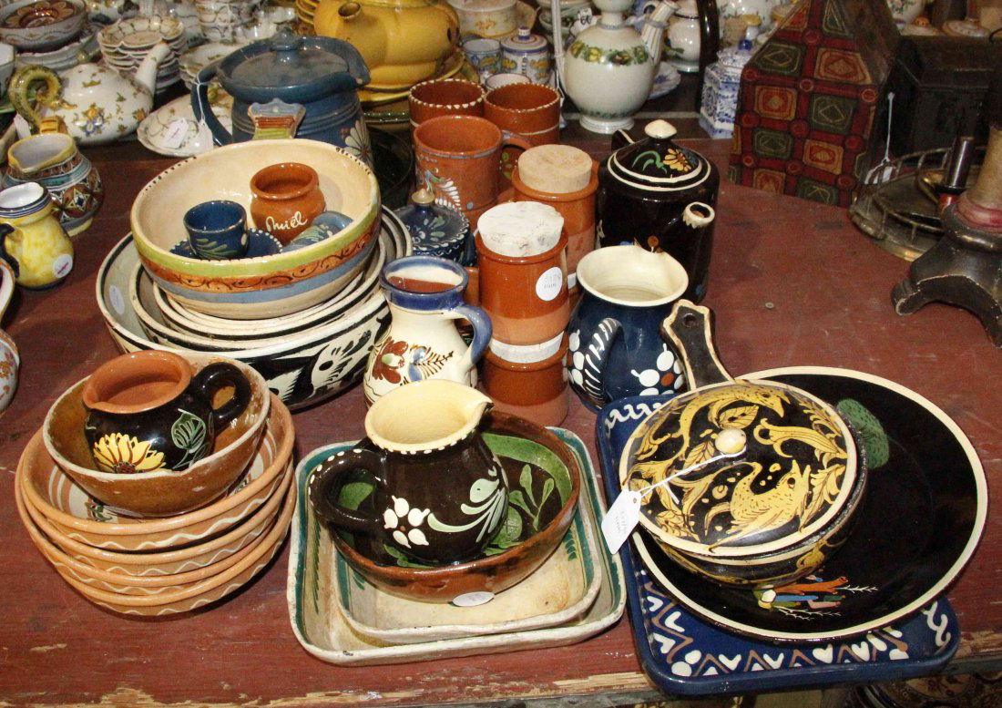 A Collection of Primarily Mexican Pottery Table: A Collection of Primarily Mexican Pottery Table Articles, including redware examples and others, comprising a set of five nesting bowls, five mugs, three ewers, three square trays and others; 38 items