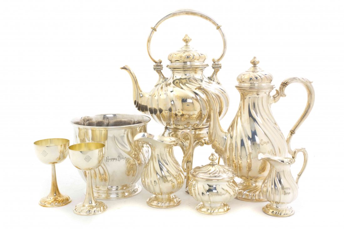 A Silverplate Coffee and Tea Service, Martin, Height of: A Silverplate Coffee and Tea Service, Martin, comprising a coffee pot and a kettle on stand with composite insulators, a milk pitcher, a creamer and a covered sugar, together with a matching wine buck