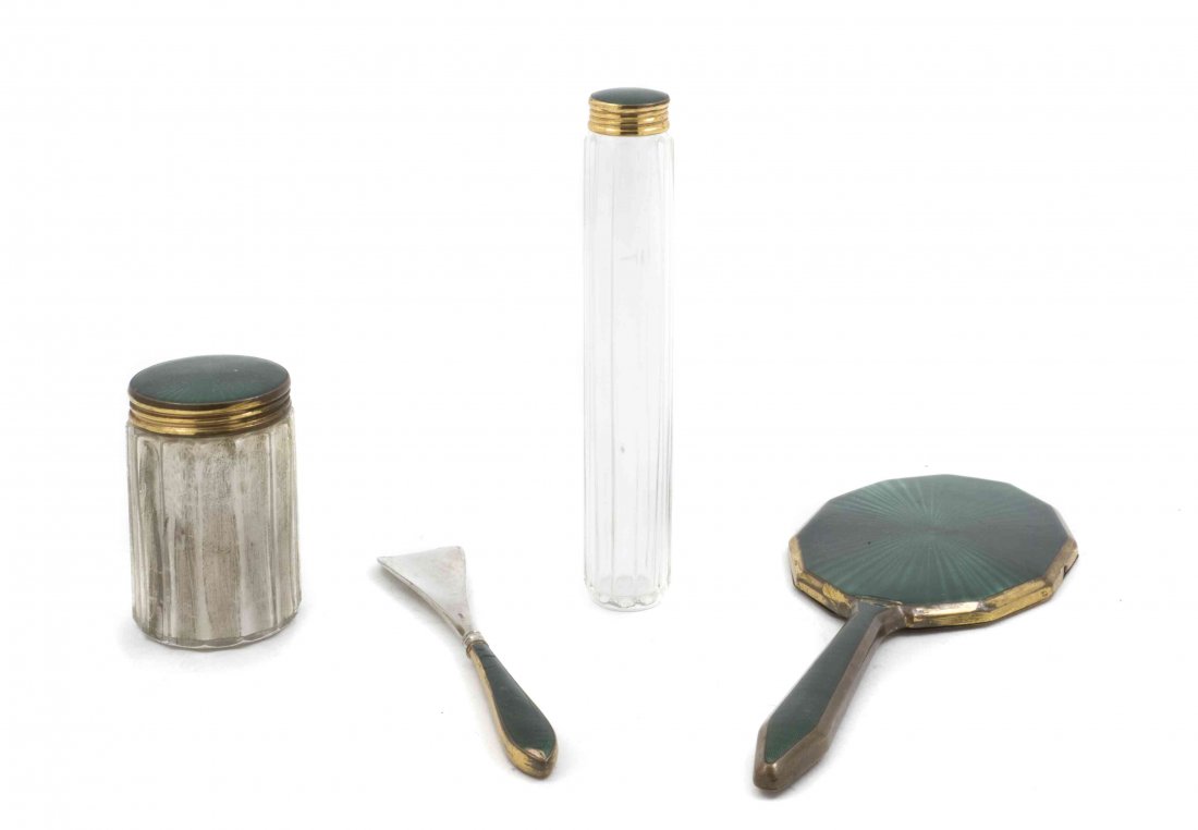 A German Gilt Silver and Guilloche Enamel Dresser Set,: A German Gilt Silver and Guilloche Enamel Dresser Set, comprising a hand mirror, a shoe horn and two glass jars. Length of longest 10 inches. Property from the Estate of Tina Lavezzorio, La Grange Par