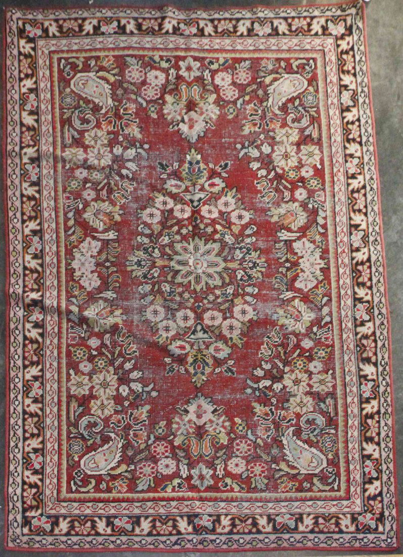 A Flatweave Wool Rug, 6 feet 6 inches x 4 feet 4: A Flatweave Wool Rug, having a central foliate medallion on a red reserve within multiple borders. 6 feet 6 inches x 4 feet 4 inches.