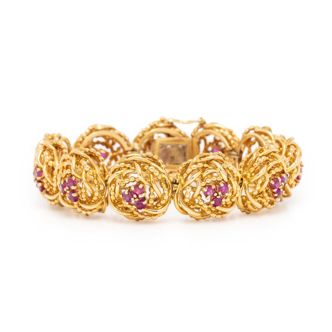 Tiffany & Co., Yellow Gold and Ruby Bracelet: Tiffany & Co., Yellow Gold and Ruby Bracelet In a stylized floral pattern, with round rubies. Mounted in yellow gold. 7 inches long. Stamp: TIFFANY & CO. Gross weight: 40.20 dwt. Property from a Priva