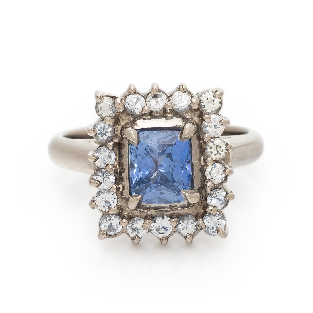Ceylon Sapphire, Diamond, and White Gold Ring: Ceylon Sapphire, Diamond, and White Gold Ring Featuring a cushion cut sapphire weighing approximately 1.80 - 2.00 carats by formula, surrounded by a rectangular halo of transitional cut diamonds weigh